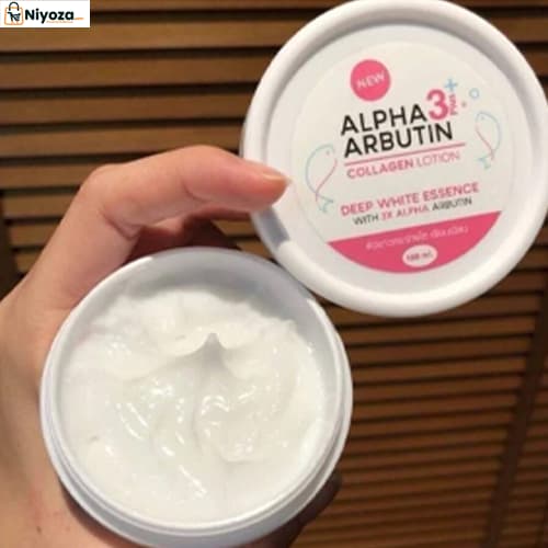 Hand holding white collagen lotion container with open lid